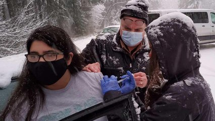 Health Care Workers Give Out Highway Vaccinations After Getting Stuck In Storm