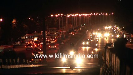 Mumbai busy street lit in vehicle tail lights _  Film city after sunset _ Urban 'Fireflies'