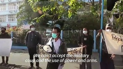 A dozen protest in Myanmar, residents bang pots and pans at night