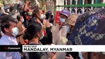 Activists' backers bring flowers to Myanmar court