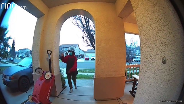 Woman Walks Away With Little Red Wagon