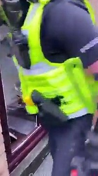 Derbyshire Police break down door in cannabis farm raid