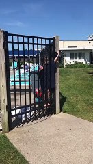 Daughter Struggles to Keep Gate Open