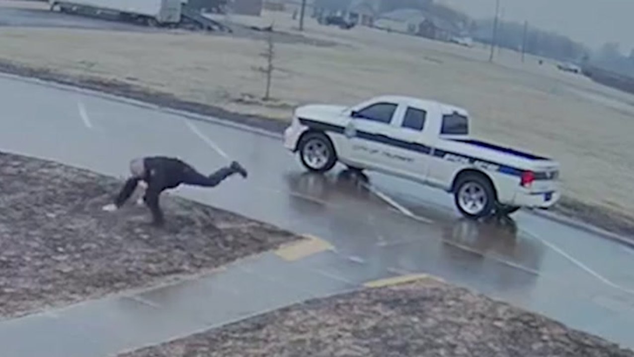 Police officer slips n' slides his way to work