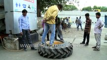 How to repair a punctured massive garbage truck tyre in India