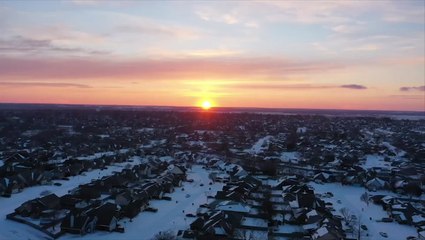 Sun sets over a snow-coated Oklahoma landscape