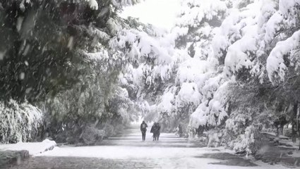 Winter storm dumps snow on Athens