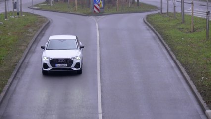 Audi Q3 TFSI e in Glacier white Driving in the city