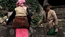 Women use their feet to wash clothes - Osla village, Uttarakhand