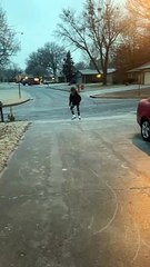 Girl Blissfully Ice Skates around Neighborhood