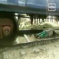Haryana Woman Escapes Unhurt After Getting Trapped Under A Moving Train