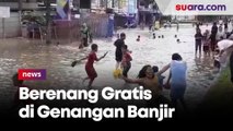 Lagi Pandemi Covid-19, Warga Tangsel Ajak Anak Renang Gratis di Genangan Air Banjir: Hiburan Gratis  Lumayanlah!