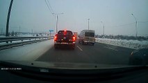 Jackknifing Truck Slides Through Traffic on Icy Road