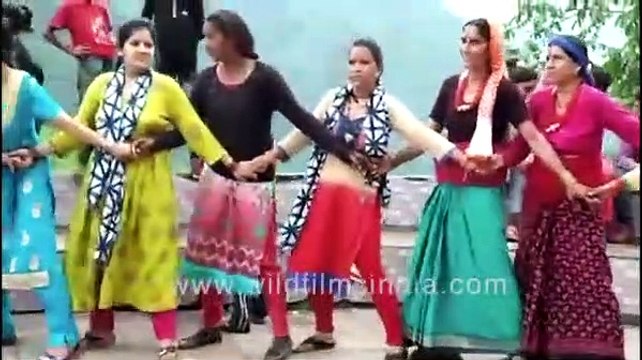 Village women join hands to dance to Garhwali Rasoi during Phulera Mela at Uttarkashi, Uttarakhand