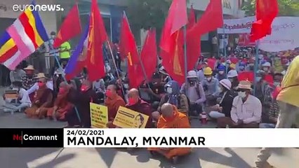 Police block the path of anti-coup protesters in Mandalay, Myanmar