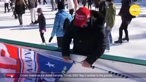 Crowd cheers as ice skater carrying Trump 2024 flag is tackled to the ground