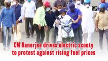 Bengal CM Banerjee drives electric scooty to protest against rising fuel prices