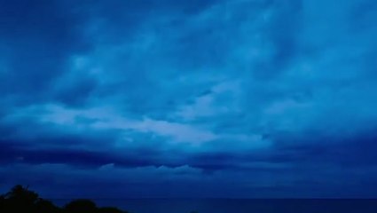 Passing rainstorm as day turns into night