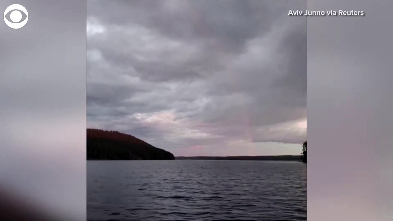 RED RAINBOW- A fisherman saw this rare red rainbow over a lake in Finland July 11