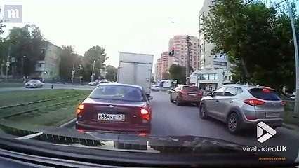 Quick-thinking man in Russia catches rogue tyre before it hits his car window