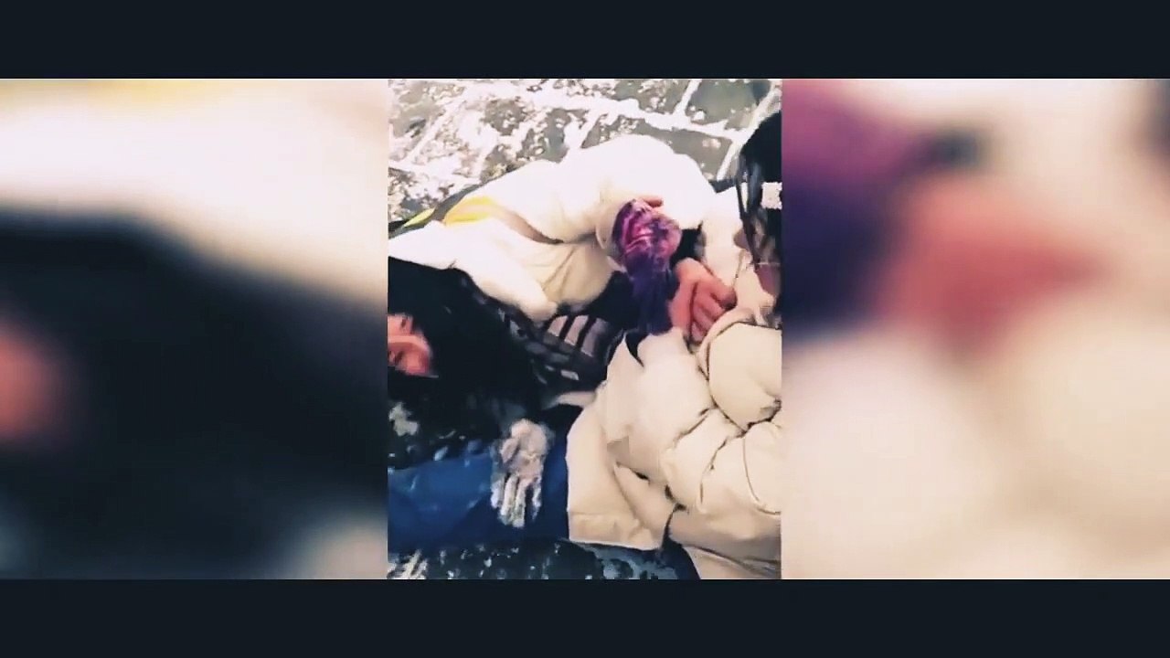 Tourists are seen slipping and struggling to walk on great wall of China after snowing.