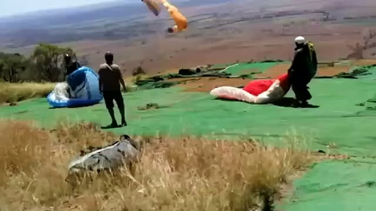 Paraglider caught in a dust devil