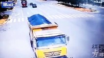 Motorcyclist miraculously survives TWO near misses with trucks