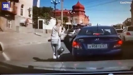 Shocking moment a spurned husband mows down wife in their family car after she demands a divorce