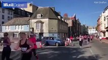 Astonishing moment motorist drives her car into half-marathon