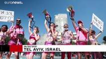 Israelis celebrate Purim with parade amid tighter COVID restrictions