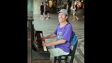 Climate justice, environment and vegan song "Save the World" by performed at Prague main train station by Pianomike