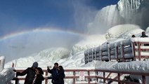 Rainbow hangs over a frozen Niagara Falls
