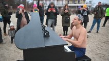 Polish pianist performs as swimmers take frosty dip for a good cause
