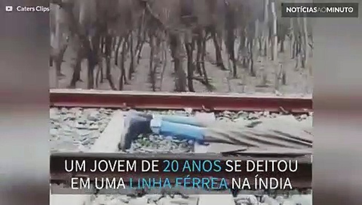 Homem deita nos trilhos e espera trem passar