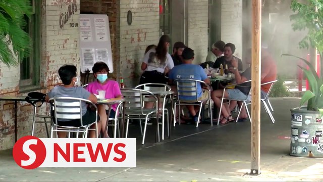 Texas lifts face mask mandate, reopens businesses