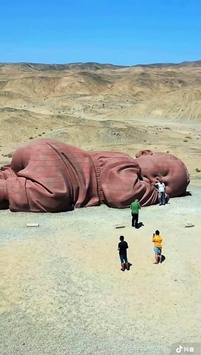 Huge sculpture of a sleeping baby in the Guangzhou desert, China