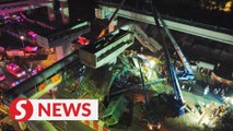 At least five people trapped in van after bridge under construction collapses