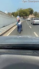 Kind Stranger Helps Person in Wheelchair up Busy Road