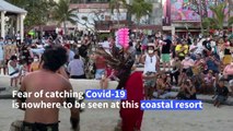 Tourists show no Covid fears as they fill Mexican resort