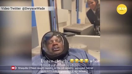 Shaquille ONeal caught napping on the job wearing astronaut helmet