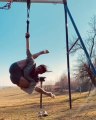 Woman Shows Amazing Contortion Skills With Aerial Straps While Hanging From Swing