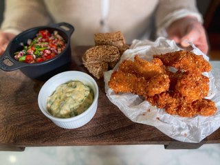 Spicy chicken goujons with sesame seed potato wedges