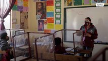 Bolivian teacher allocates part of her salary to install cubicles against COVID-19
