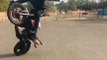 Professional Stunt Rider Spins Motorbike On One Wheel