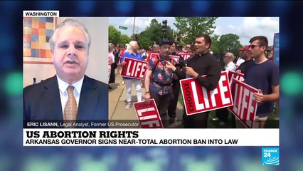 Arkansas governor signs near-total abortion ban into law