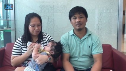 Filipino couple whose 11 month old son received cleft lips surgery