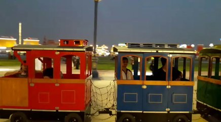 People enjoy a joyride on the train at Global Village in Dubai