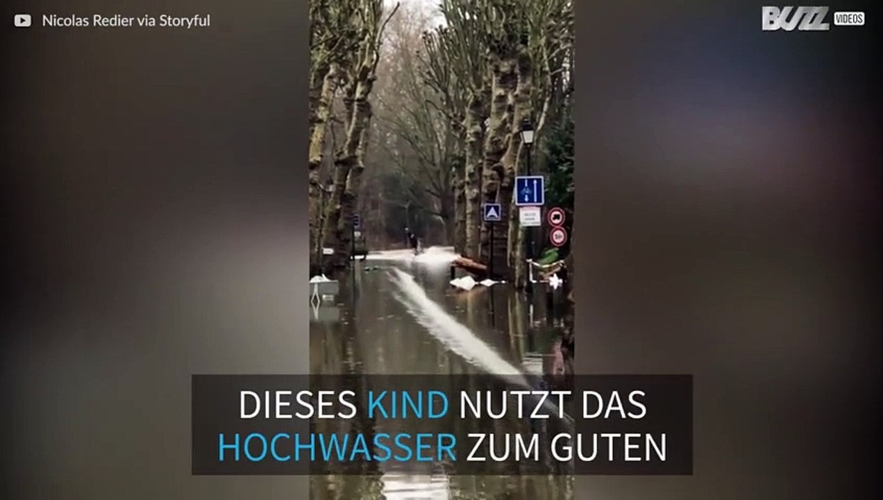 Pariser surft mit seinem Wakeboard durch die überfluteten Straßen