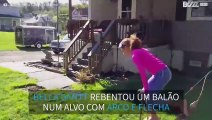 [TRANSLATE] - Rapariga rebenta balão com arco e flecha a fazer o pino!