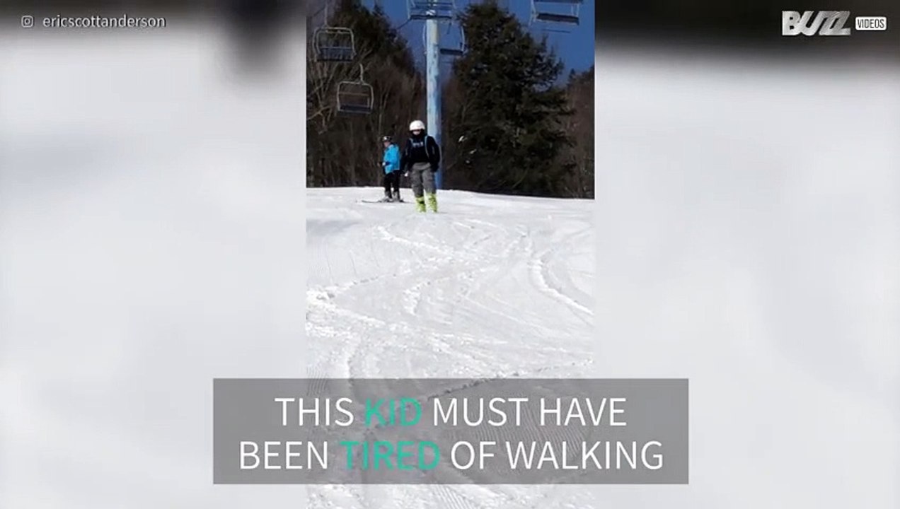 Tired boy prefers rolling down hill instead of walking